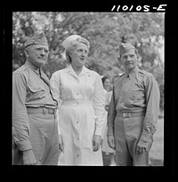 [Untitled photo, possibly related to: Detroit, Michigan. Flag presentation ceremonies at Harper Hospital. Colonel Carstens and Major Spaulding with the head nurse]. Sourced from the Library of Congress.