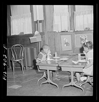 [Untitled photo, possibly related to: Washington, D.C. Free morning lunch in the kindergarten of a  school]. Sourced from the Library of Congress.
