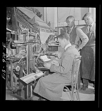 Washington, D.C. Setting type for the school paper on a lithograph machine at the Armstrong Technical High School. Sourced from the Library of Congress.