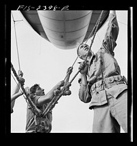 Parris Island, South Carolina. U.S. Marine Corps glider detachment training camp. A barrage balloon takes to the air under capable handling by a Marine Corps ground crew. Sourced from the Library of Congress.