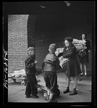 [Untitled photo, possibly related to: Washington, D.C. Scrap salvage campaign, Victory Program. Children bringing their weekly contribution of scrap paper to school]. Sourced from the Library of Congress.