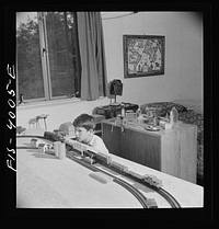 Greenbelt, Maryland. Child's bedroom in a house in which a thirteen year-old boy has rigged up model trains and a chemical laboratory. Sourced from the Library of Congress.