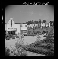 [Untitled photo, possibly related to: Greenbelt, Maryland. Federal housing project. View of the shopping center showing the moving picture house]. Sourced from the Library of Congress.