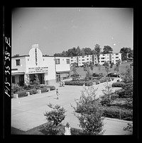 Greenbelt, Maryland. Federal housing project. View of the shopping center showing the moving picture house. Sourced from the Library of Congress.