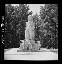 Greenbelt, Maryland. Federal housing project. Children at the drinking fountain in the shopping center square. Playground is situated in a grove of trees behind the shopping center. Sourced from the Library of Congress.
