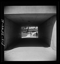 Greenbelt, Maryland. Federal housing project. Children returning from school through an underpass. Sourced from the Library of Congress.