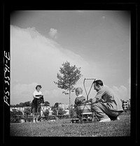 Greenbelt, Maryland. Parents taking baby's picture on Sunday. Sourced from the Library of Congress.