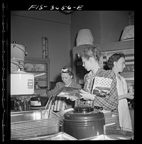 Greenbelt, Maryland. Interior of the Greenbelt variety store, a cooperative where garden tools, seeds, kitchen utensils, clothes, etc. are sold. Sourced from the Library of Congress.