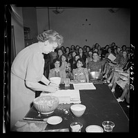Greenbelt, Maryland. The local utility company giving a cooking demonstration for Greenbelt women. Sourced from the Library of Congress.