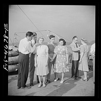 [Untitled photo, possibly related to: Washington, D.C. Applying pressure to pressure point as part of a course in first aid, aboard a Potomac River boat]. Sourced from the Library of Congress.