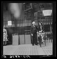 [Untitled photo, possibly related to: New York, New York. Waiting for trains at the Pennsylvania railroad station]. Sourced from the Library of Congress.