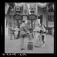 [Untitled photo, possibly related to: New York, New York. Waiting for trains at the Pennsylvania railroad station]. Sourced from the Library of Congress.