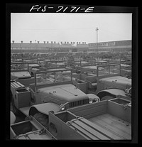 [Untitled photo, possibly related to: Detroit, Michigan (vicinity). Chrysler Corporation Dodge truck plant. Side by side and end to end of Dodge Army trucks, produced daily, stand in the yards waiting for the final touches that make them effective fighting vehicles]. Sourced from the Library of Congress.