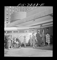 [Untitled photo, possibly related to: New York, New York. Boarding interstate buses at the Greyhound bus terminal, 34th Street]. Sourced from the Library of Congress.
