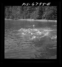 Interlochen, Michigan. National music camp where young musicians gather each summer for two months to study symphonic music. Girls swimming during the recreation period. Sourced from the Library of Congress.