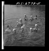 Interlochen, Michigan. National music camp where 300 or more young musicians study symphonic music for eight weeks each summer. Portrait of girl in swimming. Sourced from the Library of Congress.