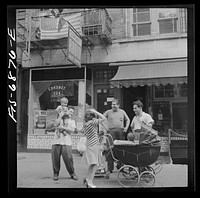 New York, New York. Italian-Americans on [Thompson] Street relaxing on Sunday. Sourced from the Library of Congress.