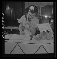 New York, New York. Receptionist making an appointment at Francois de Paris, a hairdresser on Eighth Street. Sourced from the Library of Congress.