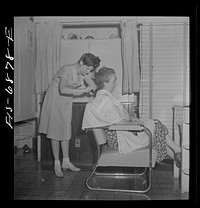 [Untitled photo, possibly related to: New York, New York. Dyeing hair at Francois de Paris, a hairdresser on Eighth Street]. Sourced from the Library of Congress.