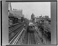 New York, New York. Looking north from the Ninth Street station on the Third Avenue elevated railway as a train leaves on the local track. Sourced from the Library of Congress.