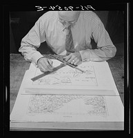 New York, New York. Art department of the New York Times newspaper. Cartographer makes map from key maps. Sourced from the Library of Congress.