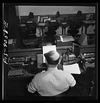 New York, New York. Wire room of the New York Times newspaper. Telegrapher receives dispatch by Western Union from Times correspondent somewhere in the United States. Sourced from the Library of Congress.
