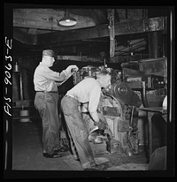 New York, New York. Pressroom of the New York Times newspaper. Casting of plates from mats in Autoplate machine. Sourced from the Library of Congress.