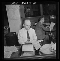 New York, New York. New York Times newspaper syndicate. Foreign newspapers and syndicates buy privilege of using Times news. The paper has so many correspondents all over the world, that often they scoop Associated Press and United Press. Swiss correspondent in foreground, Mexican in back. Sourced from the Library of Congress.