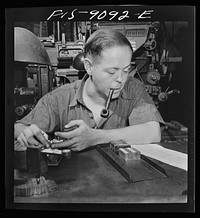 New York, New York. Composing room of the New York Times newspaper. Times daily index to the news is set partly by hand. This man has been doing it for fifteen years. Sourced from the Library of Congress.