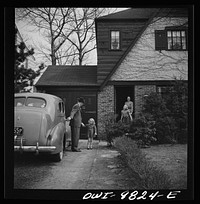 [Untitled photo, possibly related to: Passaic, New Jersey. Factory owner Carlson organized home machine shops for defense work. Carlson greeted by his family when he returns from work]. Sourced from the Library of Congress.