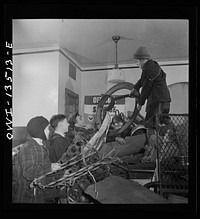 New York, New York. Italian-American boys at the Sullivan Street depot separating scrap which they have collected. Each kind of scrap goes into a separate pile. Sourced from the Library of Congress.