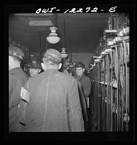 [Untitled photo, possibly related to: Pittsburgh, Pennsylvania (vicinity). Montour no. 4 mine of the Pittsburgh Coal Company. Miners getting their head and safety lamps]. Sourced from the Library of Congress.