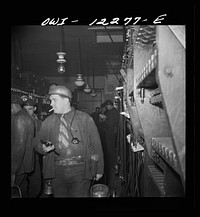 [Untitled photo, possibly related to: Pittsburgh, Pennsylvania (vicinity). Montour no. 4 mine of the Pittsburgh Coal Company. Miners getting their head and safety lamps]. Sourced from the Library of Congress.