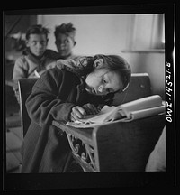 Ojo Sarco, New Mexico. One-room school in an isolated mountainous Spanish-American community, which has eight grades and two teachers. Most of the teaching is in Spanish, the language spoken in the children's homes, and as a result they rarely speak English fluently. Sourced from the Library of Congress.