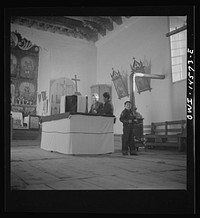 [Untitled photo, possibly related to: Trampas, New Mexico. Main altar in a church which was built in 1700 and is the best-preserved colonial mission in the Southwest]. Sourced from the Library of Congress.