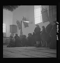 [Untitled photo, possibly related to: Trampas, New Mexico. Father Cassidy conducting mass at a church which was built in 1700 and is the best-preserved colonial mission in the Southwest]. Sourced from the Library of Congress.