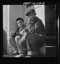 [Untitled photo, possibly related to: Chacon, Mora County, New Mexico. Idlers at the general store]. Sourced from the Library of Congress.
