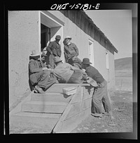 Chacon, Mora County, New Mexico. Idlers at the general store. Sourced from the Library of Congress.