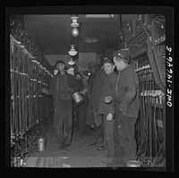 [Untitled photo, possibly related to: Pittsburgh (vicinity), Pennsylvania. Montour Number Four mine of the Pittsburgh Coal Company. Miners in the room where lamps are kept]. Sourced from the Library of Congress.