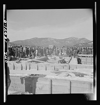Penasco, New Mexico. Crowds gathering at the dedication ceremony of the new building for the clinic operated by the Taos County cooperative health association. Sourced from the Library of Congress.