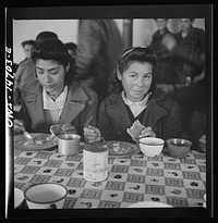 [Untitled photo, possibly related to: Penasco, New Mexico. A grade school student eating a hot lunch]. Sourced from the Library of Congress.