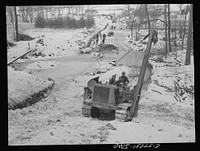 Pennsylvania section of the war emergency twenty-four inch pipeline to carry oil from Texas fields to eastern refineries, completed in July, 1943. Caterpillar tractor climbing a hill. Sourced from the Library of Congress.