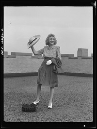 Detroit, Michigan. Fashion show presented by the Chrysler Girls' Club of the Chrysler Corporation at Saks Fifth Avenue store. Typical American girl. Sourced from the Library of Congress.