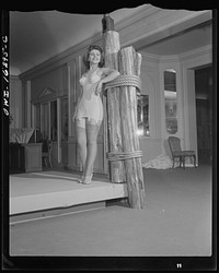 Detroit, Michigan. Fashion show presented by the Chrysler Girls' Club of the Chrysler Corporation at Saks Fifth Avenue store. Girl modeling a corsellette. Sourced from the Library of Congress.