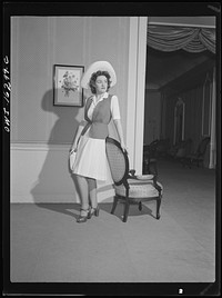 Detroit, Michigan. Fashion show presented by the Chrysler Girls' Club of the Chrysler Corporation at Saks Fifth Avenue store. Girl modeling a typical afternoon dress. Sourced from the Library of Congress.