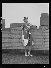 [Untitled photo, possibly related to: Detroit, Michigan. Fashion show presented by the Chrysler Girls' Club of the Chrysler Corporation at Saks Fifth Avenue store. Girl laughing]. Sourced from the Library of Congress.
