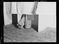 Dearborn, Michigan. National Labor Relations Board election for union representation at the River Rouge Ford plant. Workers voting in a secret booth. Sourced from the Library of Congress.