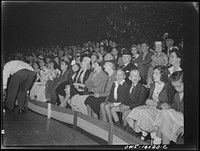 Detroit, Michigan. A Venetian night party at the Detroit yacht club, whose members represent the wealthier class of manufacturers and their friends. Crowd watching an outdoor circus. Sourced from the Library of Congress.