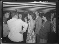 [Untitled photo, possibly related to: Detroit, Michigan. A Venetian night party at the Detroit yacht club, whose members represent the wealthier class of manufacturers and their friends. Couple kissing in a boat]. Sourced from the Library of Congress.