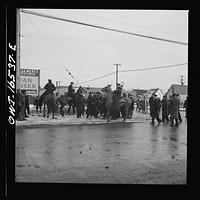Detroit, Michigan. Riot at the Sojourner Truth homes, a new U.S. federal housing project, caused by white neighbors' attempt to prevent  tenants from moving in. Mounted police moving a group of Negroes. Sourced from the Library of Congress.